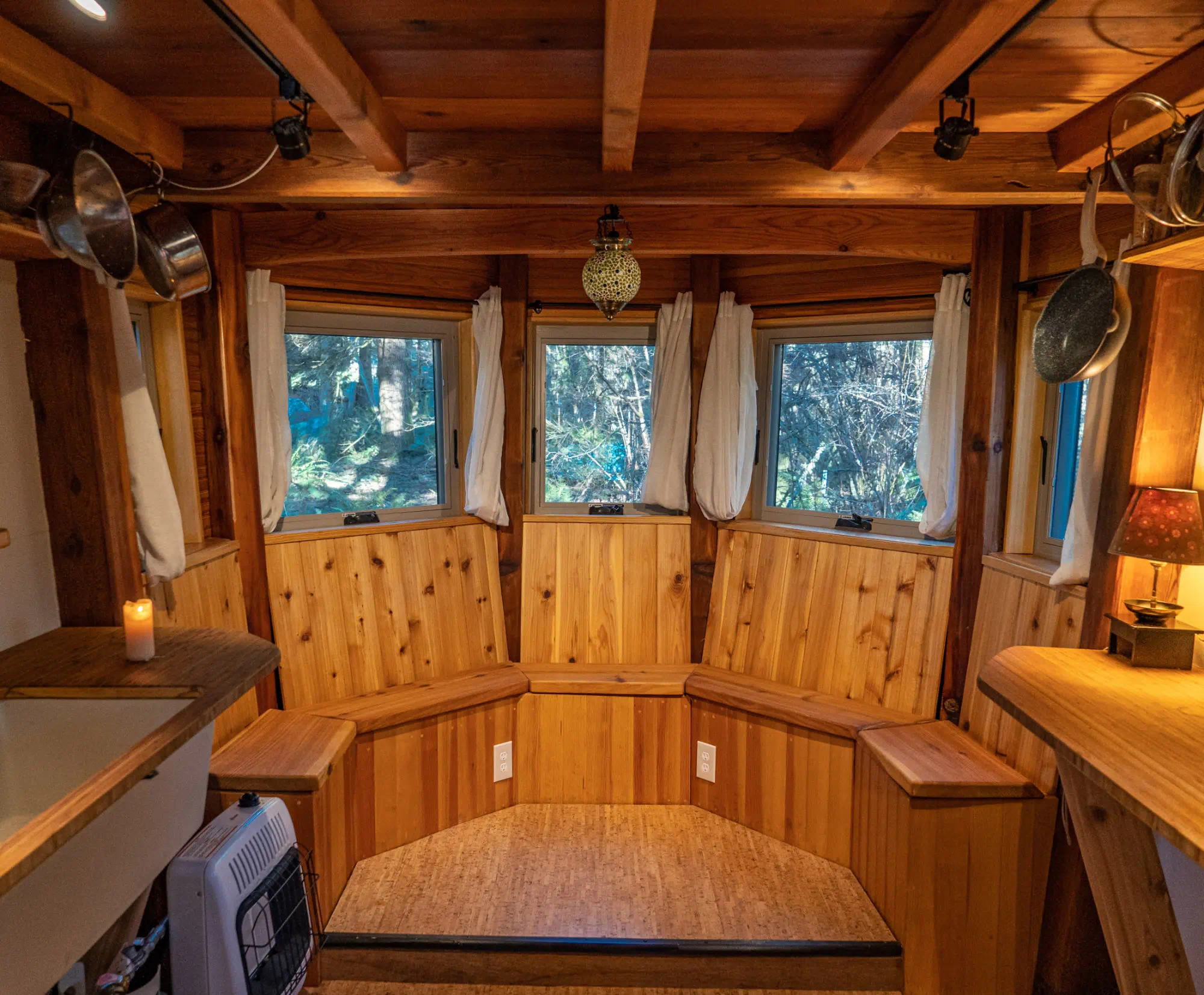 Cozy cedar cabin interior with forest views